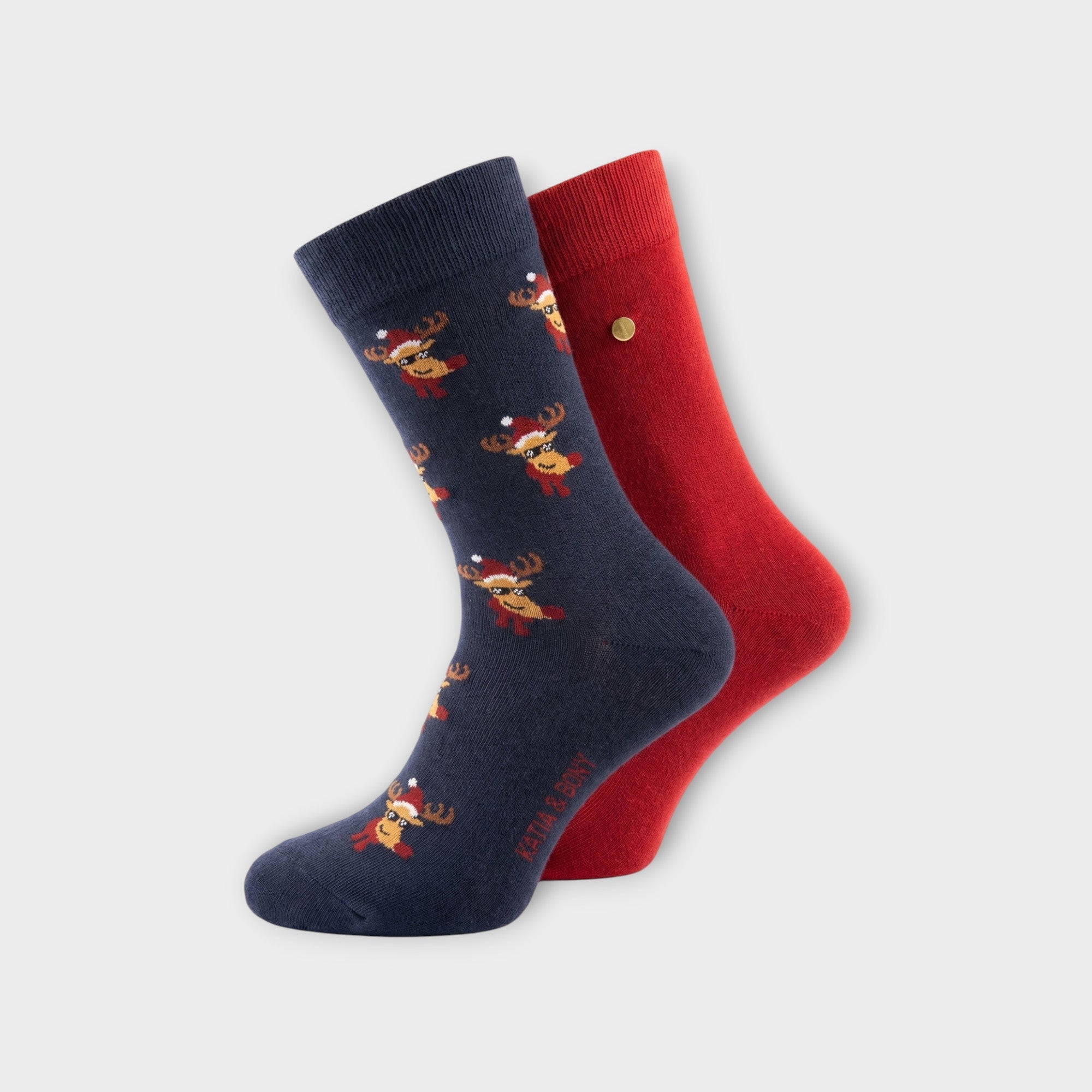 Katia & Bony 2er-Pack Weihnachtssocken: Ein Paar dunkelblau mit Rentier-Muster und Sonnenbrille, ein Paar einfarbig dunkelrot